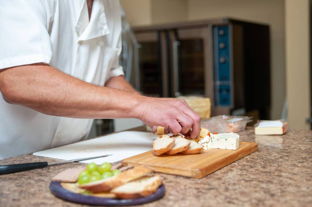 ETHAN CAIRNS / WINNIPEG FREE PRESS
Jacques assembles a board with pâté, cheese and bread using Frères Jacques packaged pâté.