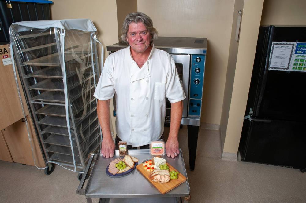 ETHAN CAIRNS / WINNIPEG FREE PRESS
Larry Jacques shows off his pâté in a local community commercial kitchen.