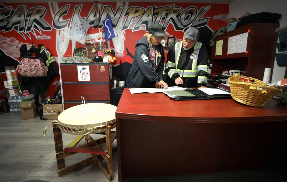 RUTH BONNEVILLE / WINNIPEG FREE PRESS  The new missing persons initiative will streamline the reporting process and strengthen relationships between communities and the police, says Bear Clan executive director Kevin Walker.
                                RUTH BONNEVILLE / WINNIPEG FREE PRESS  Bear Clan executive director Kevin Walker and Angela Klassen, lead co-ordinator for the new initiative, look over files in their office.