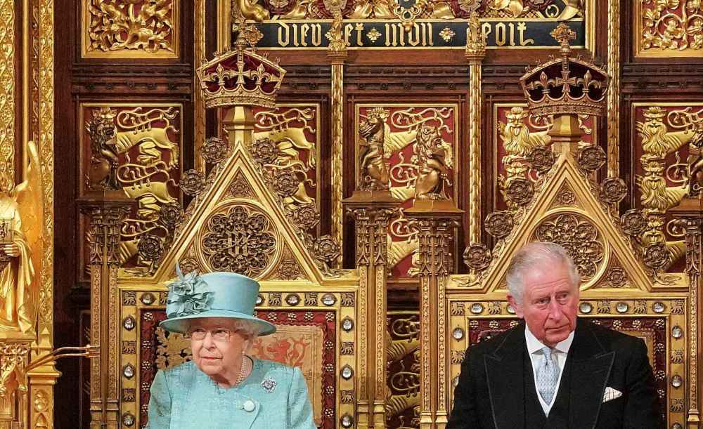 Hannah McKay / Pool / The Associated Press
Britain's Queen Elizabeth II and Prince Charles sit in the chamber ahead of the State Opening of Parliament at the Houses of Parliament in London.