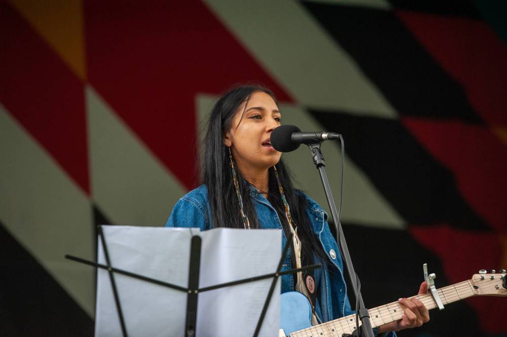 Ashley Ghostkeeper performs on stage during the Sakihiwe Festival at Central Park on Saturday. (Ethan Cairns / Winnipeg Free Press)