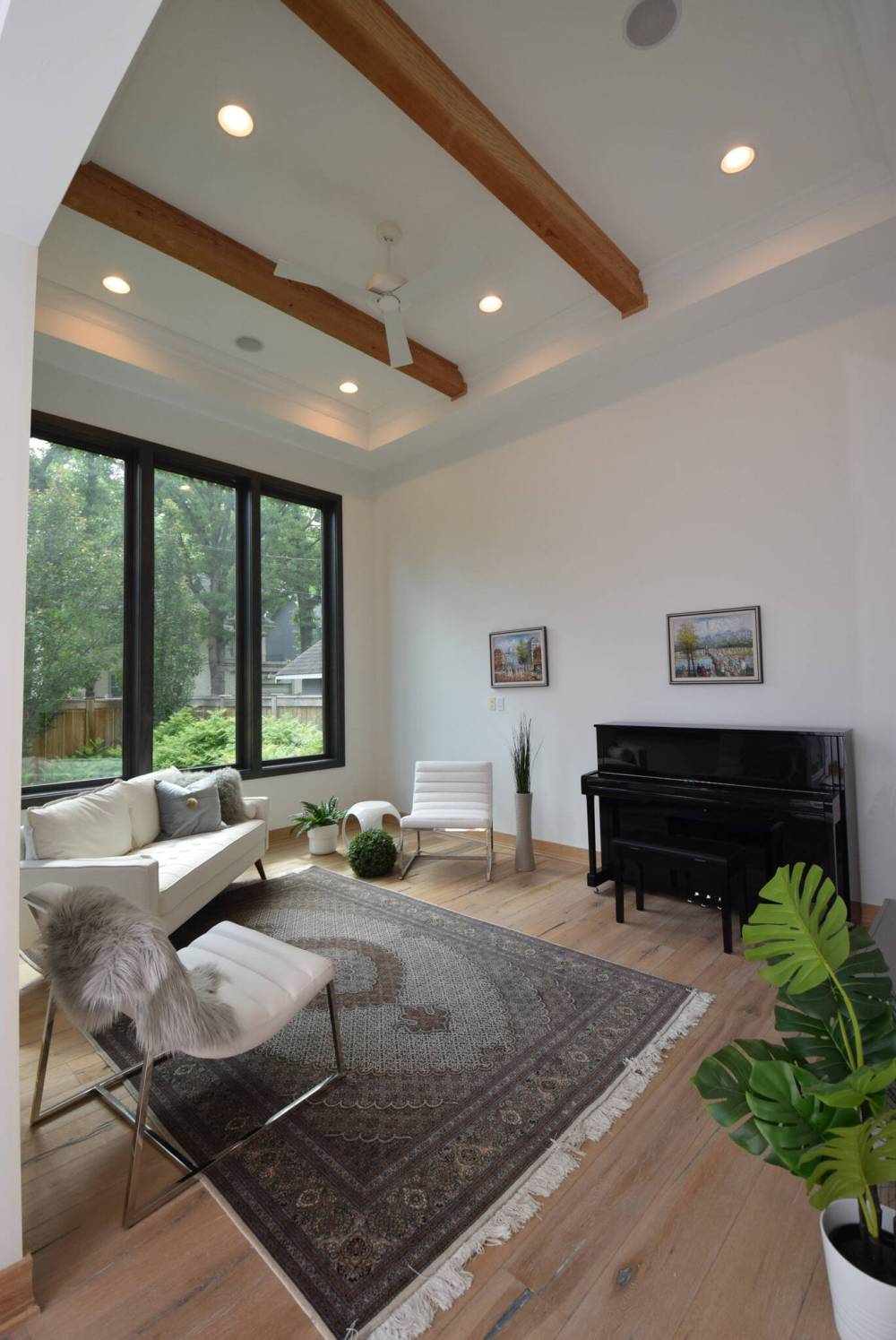 Floor-to-ceiling windows combine with a soaring ceiling on the mezzanine level.