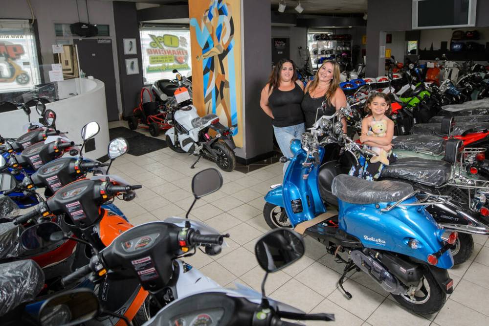 ETHAN CAIRNS / WINNIPEG FREE PRESS
Orly, Leehee and Ivry Hasid of Scooter City. “I believe the culture of scooters has grown so much, and every year, it grows more,” said Leehee Hasid, general manager of Scooter City.