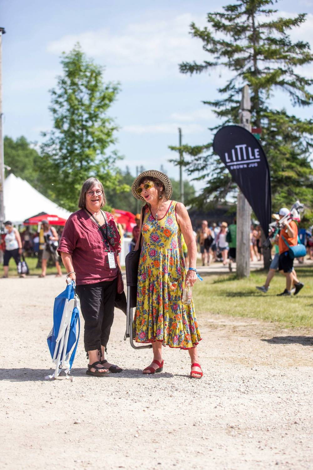 MIKAELA MACKENZIE / WINNIPEG FREE PRESS Joanne Mills (left) and Salli Portnoy pose for a photo at the Winnipeg Folk Fest in Bird’s Hill Park on Friday, July 8, 2022. For Eva Wasney fashion story. Winnipeg Free Press 2022.