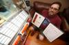 Sarazin shows off patents for protective LP record sleeves he has designed. (John Woods / Winnipeg Free Press)