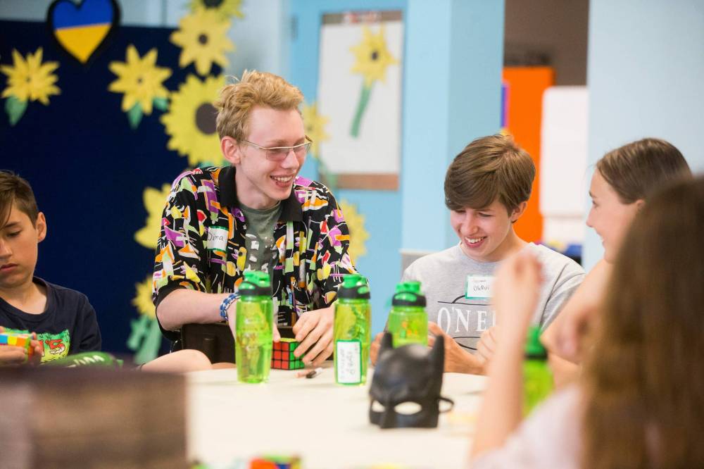 MIKAELA MACKENZIE / WINNIPEG FREE PRESS  Dima Oliinyk (left), 15, and Oleksil Petruchek, 15, solve Rubik’s Cubes on Tuesday.