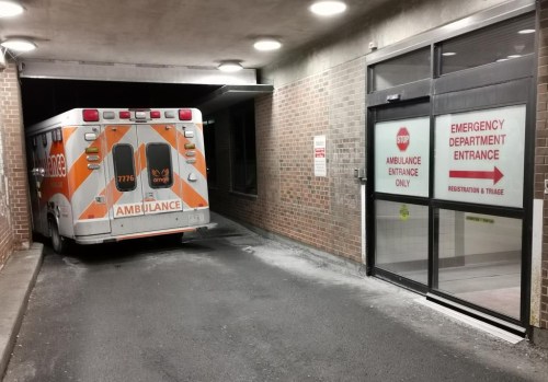 An ambulance is parked at the emergency department at the Lakeridge Health hospital in Bowmanville, Ont. on Wednesday January 12, 2022.&nbsp;Ontario’s health minister would not rule out further privatization in health care among a number of possibilities being considered as the province deals with major staff shortages in hospitals.THE CANADIAN PRESS/Doug Ives