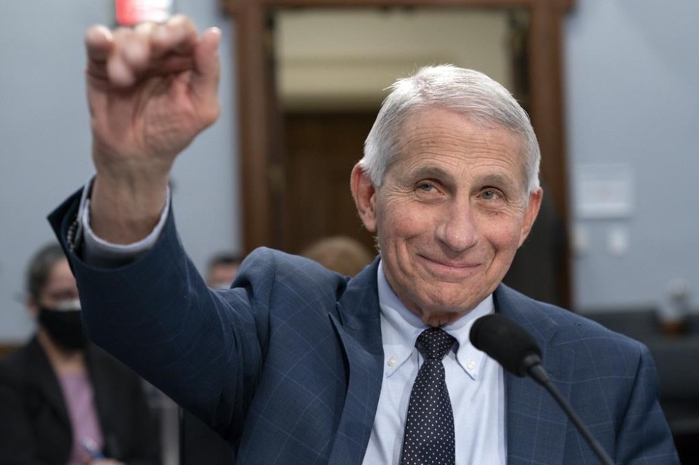 FILE - Dr. Anthony Fauci, Director of the National Institute of Allergy and Infectious Diseases, waves hello to the committee at the start of a House Committee on Appropriations subcommittee on Labor, Health and Human Services, Education, and Related Agencies hearing, about the budget request for the National Institutes of Health, May 11, 2022, on Capitol Hill in Washington. Fauci, the nation's top infectious disease expert who became a household name, and the subject of partisan attacks, during the COVID-19 pandemic, announced Monday he will depart the federal government in December after more than 5 decades of service. (AP Photo/Jacquelyn Martin, File)