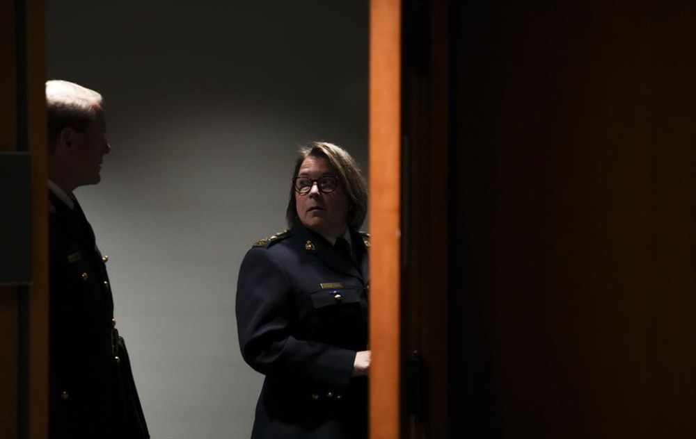 RCMP Commissioner Brenda Lucki and deputy commissioner Brian Brennan wait to appear as a witnesses at the Standing Committee on Public Safety and National Security on Parliament Hill, in Ottawa, on Monday, July 25, 2022. THE CANADIAN PRESS/Sean Kilpatrick