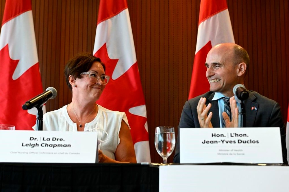 Minister of Health Jean-Yves Duclos applauds after announcing Dr. Leigh Chapman as Canada’s Chief Nursing Officer during a news conference in Ottawa, on Tuesday, Aug. 23, 2022. THE CANADIAN PRESS/Justin Tang