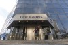 Five Manitobans, including a pastor who openly defied COVID-19 restrictions, have been convicted of repeatedly violating pandemic public health orders and are to learn their sentence Thursday. People enter the Law Courts in Winnipeg, Monday, February 5, 2018. THE CANADIAN PRESS/John Woods