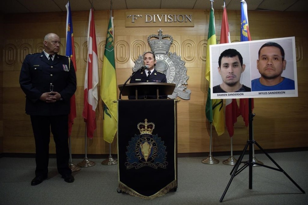 Assistant Commissioner Rhonda Blackmore speaks while Regina Police Chief Evan Bray, left, looks on during a press conference at RCMP