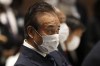FILE - Haruyuki Takahashi, executive board member of the Tokyo Organizing Committee of the Olympic and Paralympic Games attends the Tokyo 2020 Executive Board Meeting in Tokyo on March 30, 2020. Criminal allegations against a former Tokyo Olympic organizing committee board member widened Tuesday, Sept. 6, 2022, as Japanese prosecutors “re-arrested” Takahashi in suspected payments from a publisher that became a sponsor for the Games. (Issei Kato/Pool Photo via AP, File)