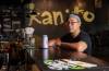 Kultivation Festival executive director Allen Pineda with a special beer for the festival in Kanto, one of the venues that will be hosting activities throughout the weekend in Winnipeg.(ETHAN CAIRNS / WINNIPEG FREE PRESS)