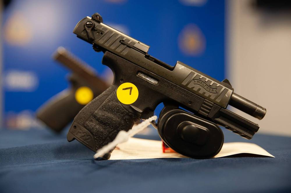 ETHAN CAIRNS / WINNIPEG FREE PRESS
A gun which has been illegally trafficked into the city has its serial number scratched off to avoid easy tracking of the weapon on display at the police press conferance.