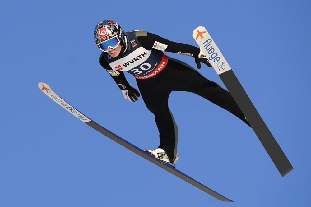 FILE - Norway's Marius Lindvik competes during the World Cup ski jumping in Vikersundbakken, Norway, Saturday March 12, 2022. Ski jumping governing bodies from the United States and Norway have forged an unprecedented partnership. USA Nordic Sport and Norges Hopplandslaget announced Wednesday, Aug. 24, 2022, that their national ski jumping teams will share coaches and training facilities as part of a four-year agreement.(Terje Bendiksby/NTB via AP, File)