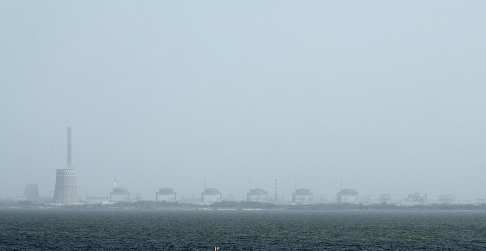 FILE - A view of the Zaporizhzhya nuclear plant and the Dnipro river on the other side of Nikopol, Ukraine on Aug, 22, 2022. (AP Photo/Evgeniy Maloletka, File)