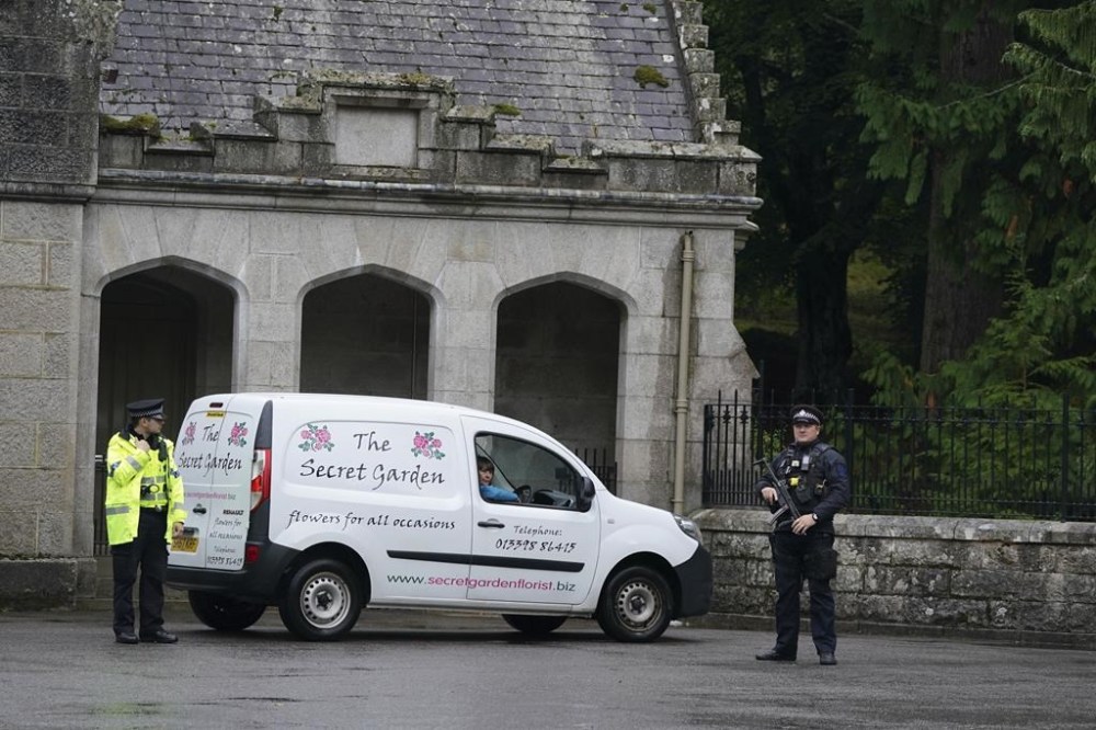 A florist van at the gates of Balmoral in Scotland, where Britain's Queen is under medical supervision, Thursday, Sept. 8, 2022. Buckingham Palace says Queen Elizabeth II has been placed under medical supervision because doctors are “concerned for Her Majesty’s health.” Members of the royal family traveled to Scotland to be with the 96-year-old monarch. The announcement comes a day after the queen canceled a virtual meeting of her Privy Council when doctors advised her to rest following a full day of events on Tuesday, when she formally asked Liz Truss to become prime minister. (Andrew Milligan/PA via AP)