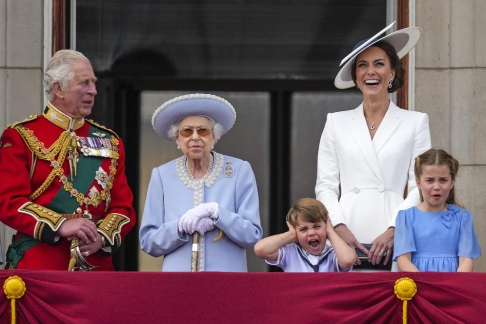 FILE - Britain's Prince Charles, Queen Elizabeth II, Prince Louis, Kate, Duchess of Cambridge, Princess Charlotte, from left, stand on the balcony of Buckingham Palace, London, Thursday June 2, 2022, on the first of four days of celebrations to mark the Platinum Jubilee. Queen Elizabeth II, Britain’s longest-reigning monarch and a rock of stability across much of a turbulent century, has died. She was 96. Buckingham Palace made the announcement in a statement on Thursday Sept. 8, 2022. (AP Photo/Alastair Grant, File)