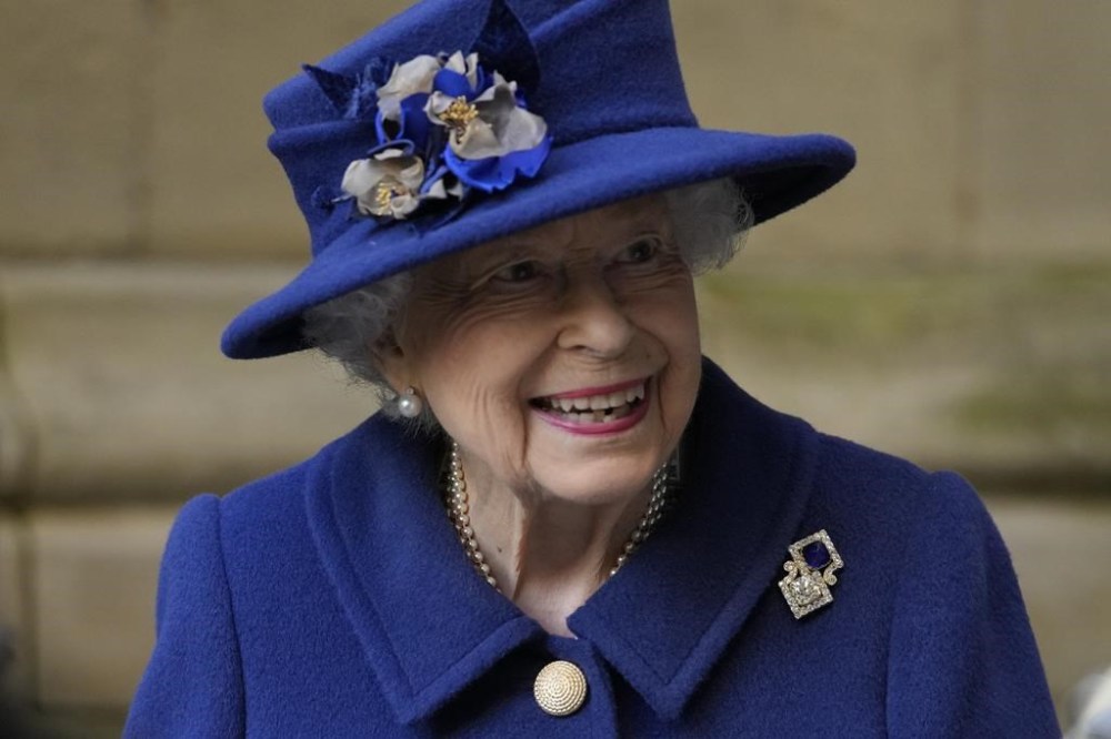 FILE -Britain's Queen Elizabeth II, smiles as she leaves a service of Thanksgiving to mark the Centenary of the Royal British Legion at Westminster Abbey, in London, Oct. 12, 2021. Queen Elizabeth II, Britain’s longest-reigning monarch and a rock of stability across much of a turbulent century, has died. She was 96. Buckingham Palace made the announcement in a statement on Thursday Sept. 8, 2022 (AP Photo/Frank Augstein, Pool, File)
