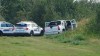 Police and investigators are seen at the side of the road outside Rosthern, Sask., on Wednesday, Sept. 7, 2022. In late spring, a parole officer issued an arrest warrant for Myles Sanderson, a Saskatchewan man with a violent past who had recently been released from prison. THE CANADIAN PRESS/Kelly Geraldine Malone