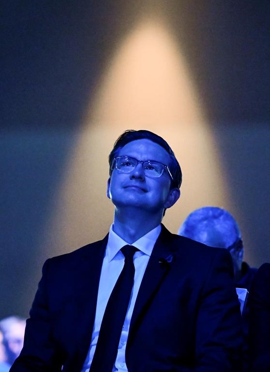 Conservative Party leadership candidate Pierre Poilievre is bathed in blue light as he listens to speeches at the Conservative Party of Canada leadership vote, in Ottawa, on Saturday, Sept. 10, 2022. THE CANADIAN PRESS/Justin Tang