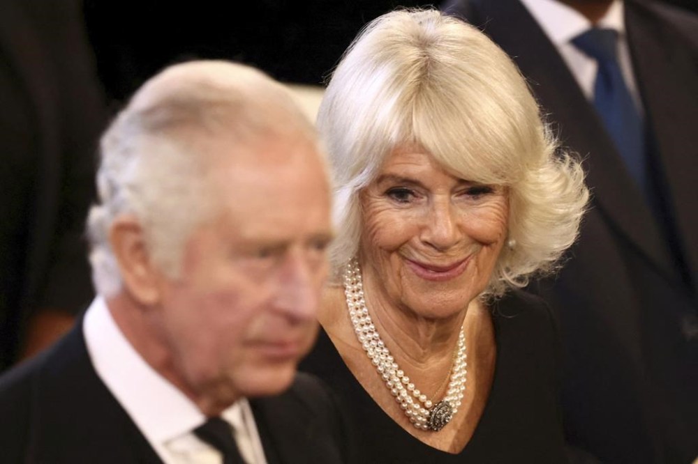 Britain's King Charles III, left, and Camilla, the Queen Consort, arrive Westminster Hall, where both Houses of Parliament are meeting to express their condolences following the death of Queen Elizabeth II, at Westminster Hall, in London, Monday, Sept. 12, 2022. Queen Elizabeth II, Britain's longest-reigning monarch, died Thursday after 70 years on the throne. (Henry Nicholls/Pool Photo via AP)