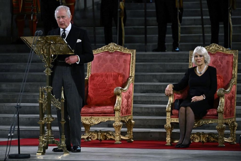 King Charles III gives his address thanking the members of the House of Lords and the House of Commons for their condolences, at Westminster Hall, in London, Monday, Sept. 12, 2022. Queen Elizabeth II, Britain's longest-reigning monarch and a rock of stability across much of a turbulent century, died Thursday Sept. 8, 2022, after 70 years on the throne. She was 96. (Ben Stansall/Pool Photo via AP)