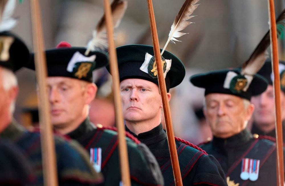 Members of the Royal Company of Archers march at St Giles Cathedral, in Edinburgh, Scotland, Tuesday, Sept. 13, 2022. King Charles III and Camilla, the Queen Consort, flew to Belfast from Edinburgh on Tuesday, the same day the queen’s coffin will be flown to London from Scotland. (Carl Recine/Pool Photo via AP)