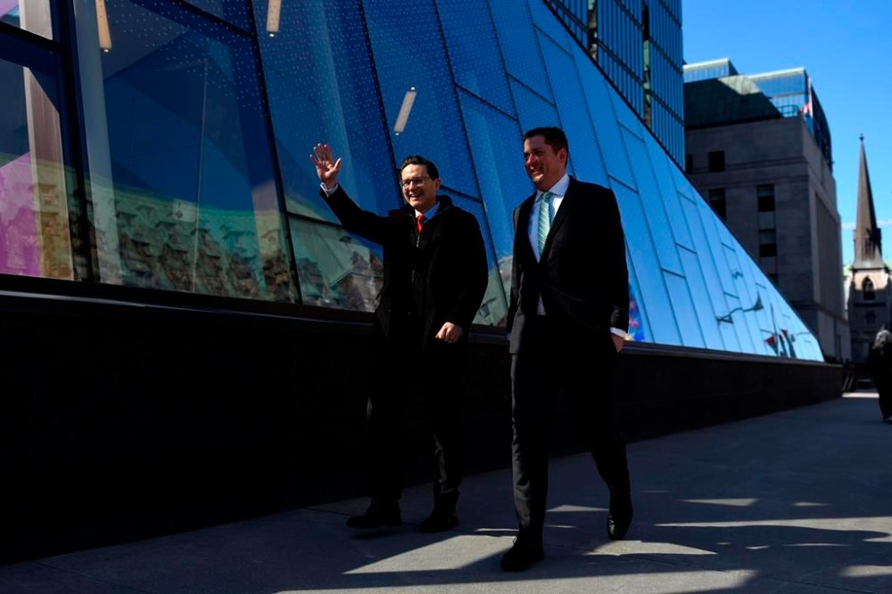 Conservative MP and leadership candidate Pierre Poilievre walks with his caucus colleague Andrew Scheer, a former leader of the party, as they arrive for a press conference outside the Bank of Canada in Ottawa, on Thursday, April 28, 2022. Poilievre is tapping Scheer to serve as his chief lieutenant in the House of Commons, as the newly minted Conservative leader prepares his party for next week's return of Parliament. THE CANADIAN PRESS/Justin Tang