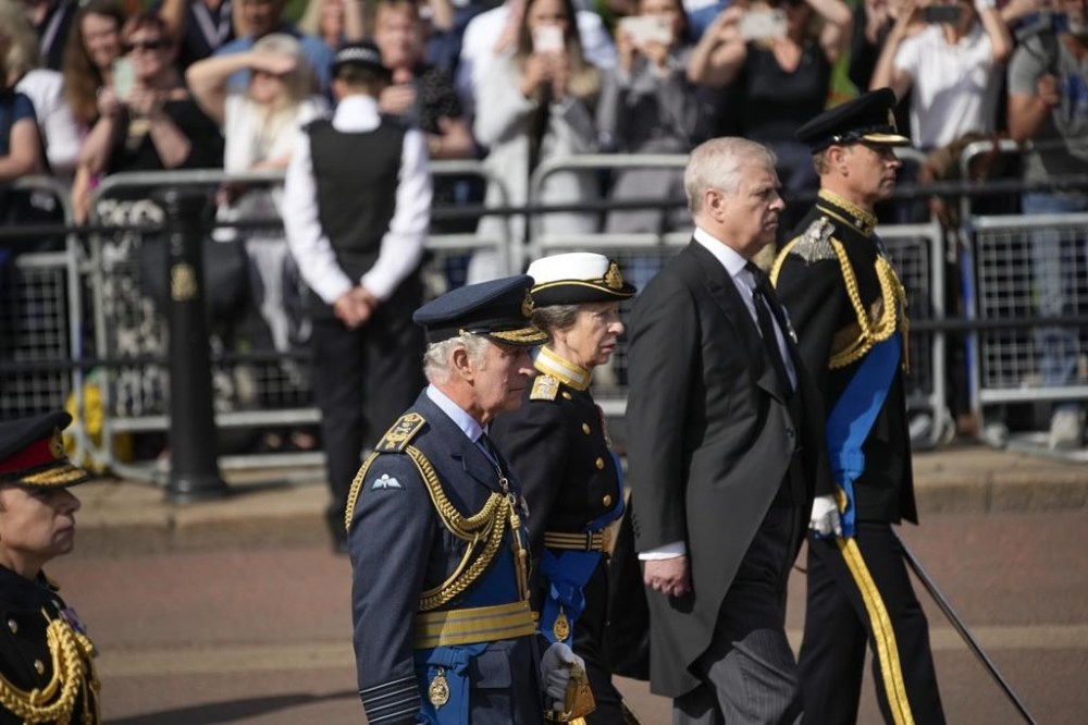 Britain's King Charles III, Princess Anne , Prince Andrew and Prince Edward follow the coffin of Queen Elizabeth II during a procession from Buckingham Palace to Westminster Hall in London, Wednesday, Sept. 14, 2022. The Queen will lie in state in Westminster Hall for four full days before her funeral on Monday Sept. 19. (AP Photo/Christophe Ena, Pool)