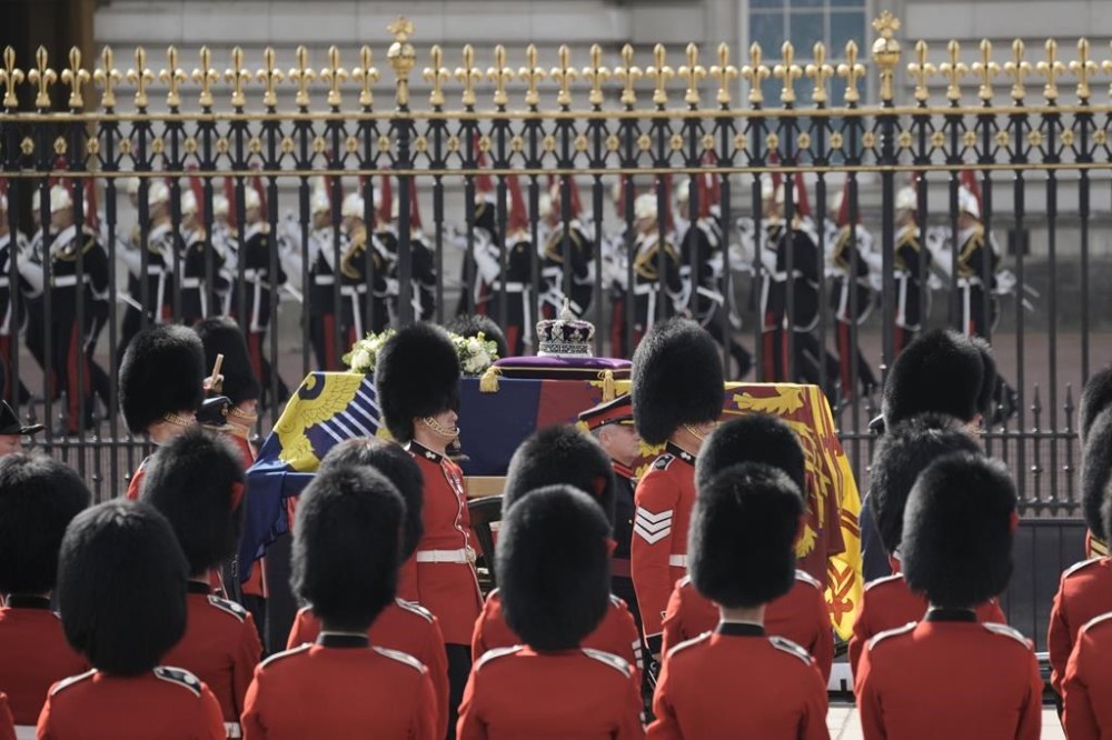 The coffin of Queen Elizabeth II leaves Buckingham Palace for Westminster Hall in London, Wednesday, Sept. 14, 2022. The Queen will lie in state in Westminster Hall for four full days before her funeral on Monday Sept. 19. (AP Photo/Vadim Ghirda, Pool)