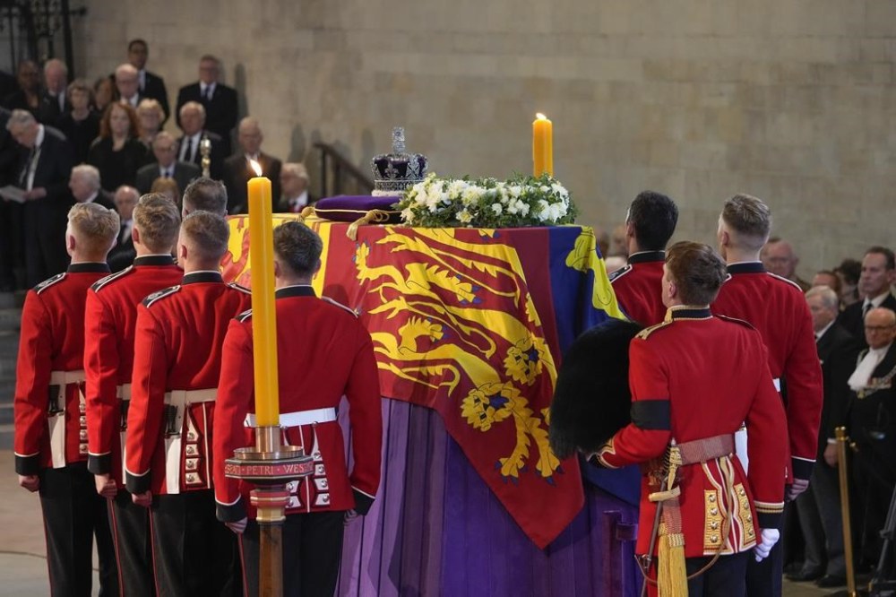 The coffin of Queen Elizabeth arrives at Westminster Hall in London, Wednesday, Sept. 14, 2022. The Queen will lie in state in Westminster Hall for four full days before her funeral on Monday Sept. 19. (AP Photo/Gregorio Borgia, Pool)