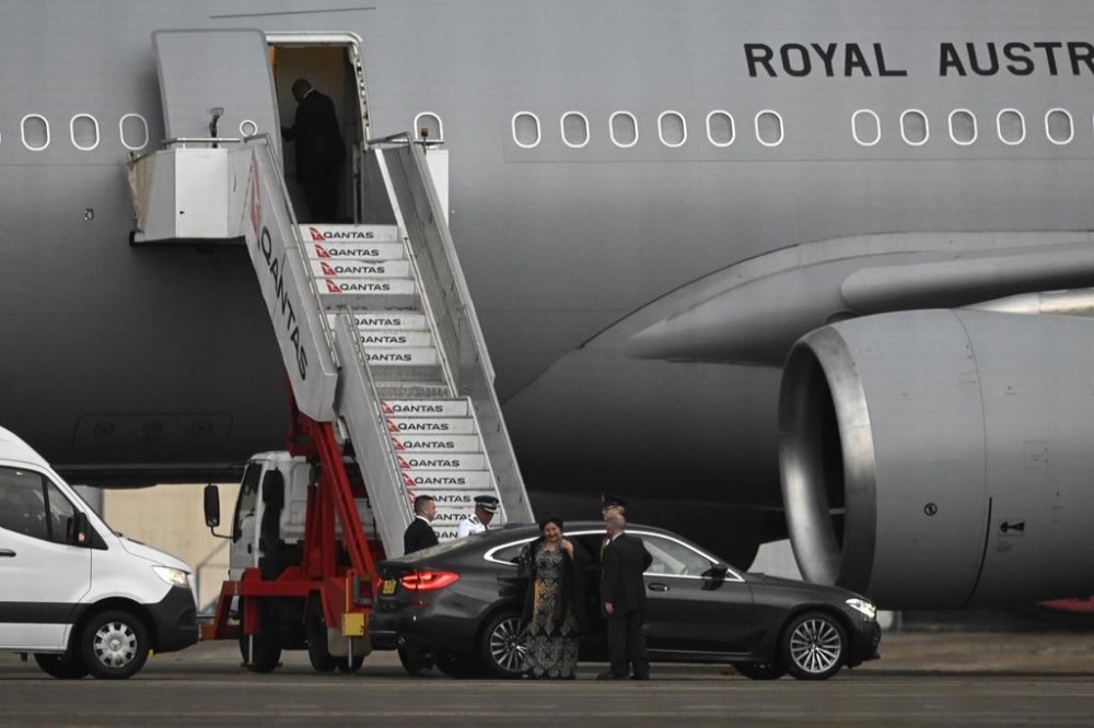 Dignitaries prepare to board one of two Royal Australian Air Force aircraft at Sydney Airport, in Sydney, Thursday, Sept. 15, 2022. Australia said it is helping officials from Solomon Islands, Papua New Guinea, Tuvalu, Samoa and a fifth unnamed British Commonwealth nation in the Oceania region travel to London for Queen Elizabeth II's funeral. (Dean Lewins/AAP Image via AP)
