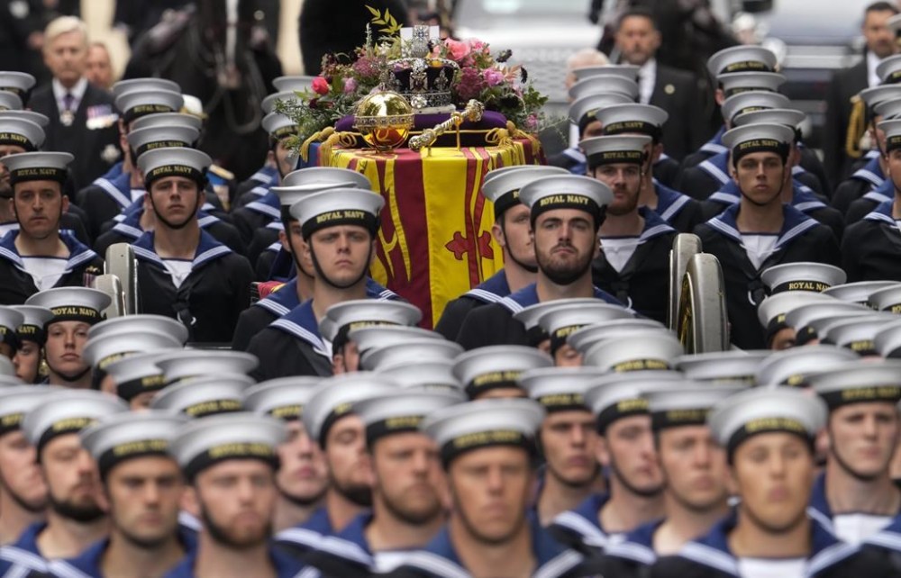 The coffin of Queen Elizabeth II is carried into Westminster Abbey for her funeral in central London, Monday, Sept. 19, 2022. (AP Photo/Bernat Armangue, Pool)