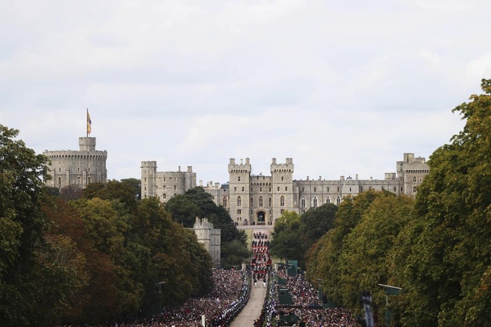 The coffin of Queen Elizabeth II is carried in a hearse towards Windsor Castle during her funeral procession in Windsor, England, Monday, Sept. 19, 2022. (Alex Pantling/Pool photo via AP)