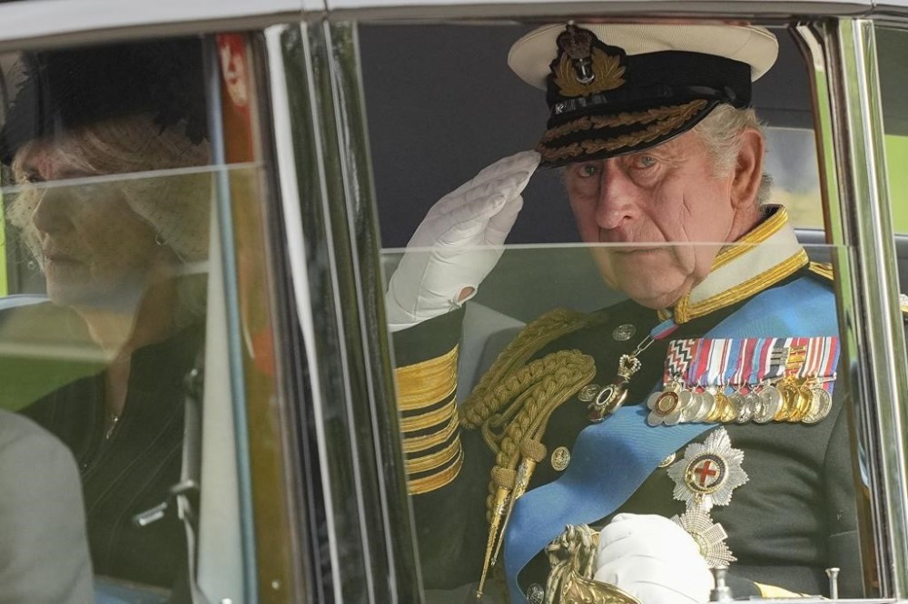 FILE - King Charles III salutes as he leaves Westminster Abbey following the state funeral service of Queen Elizabeth II in Westminster Abbey in central London Monday Sept. 19, 2022. King Charles III faces the task of preserving a 1,000-year-old monarchy that his mother nurtured for seven decades but that faces an uncertain future. The challenge is immense. (AP Photo/Martin Meissner, Pool, File)