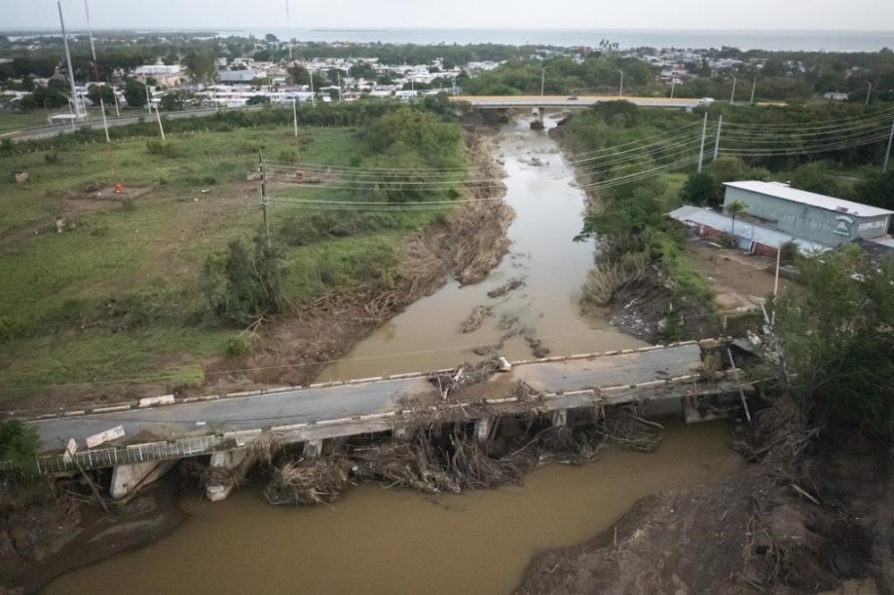 View of a damaged bridge after Hurricane Fiona hit Villa Esperanza in Salinas, Puerto Rico, Wednesday, September 21, 2022. (AP Photo/Alejandro Granadillo)
