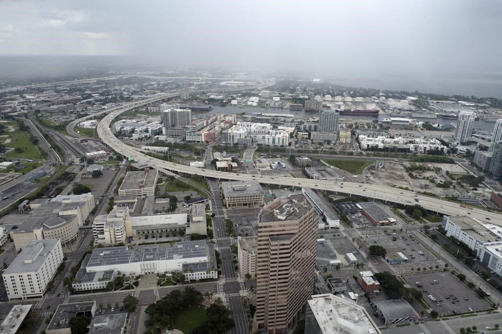 In this aerial image, the city of Tampa, Fla., is seen Monday, Sept. 26, 2022. Hurricane Ian was growing stronger as it barreled toward Cuba on a track to hit Florida's west coast as a major hurricane as early as Wednesday. It's been more than a century since a major storm like Ian has struck the Tampa Bay area, which blossomed from a few hundred thousand people in 1921 to more than 3 million today. (DroneBase via AP)