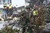 Cpl. Owen Donovan of the Cape Breton Highlanders removes brush under the direction of Nova Scotia Power officials along Steeles Hill Road in Glace Bay, N.S., Monday, Sept. 26, 2022. Justin Trudeau is scheduled to travel today to P.E.I. and Nova Scotia, where he will meet with residents and inspect the extensive damage caused by post-tropical storm Fiona. THE CANADIAN PRESS/Vaughan Merchant