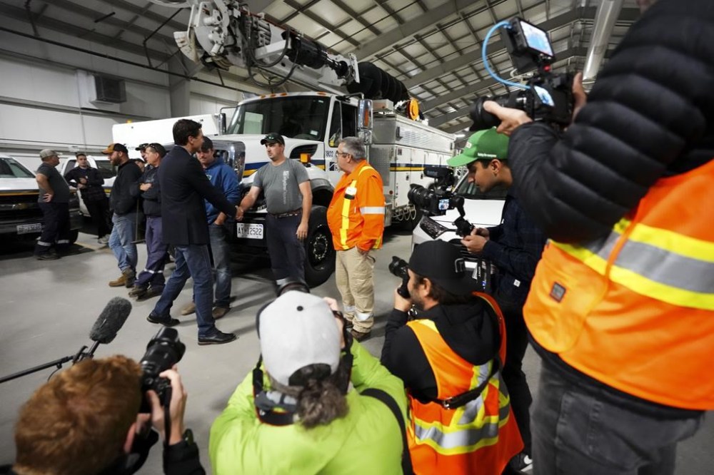 Prime Minister Justin Trudeau meets with Hydro Ottawa workers on Monday, Sept. 26, 2022. Hydro One says it's sending some 30 workers to help restore power in Nova Scotia in the wake of post-tropical storm Fiona. THE CANADIAN PRESS/Sean Kilpatrick