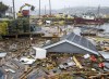 Heavy machinery clears up washed-up buildings and rubble in the harbour in Burnt Islands, N.L., on Tuesday, Sept. 27, 2022. Fiona left a trail of destruction across much of Atlantic Canada, stretching from Nova Scotia's eastern mainland to Cape Breton, Prince Edward Island and southwestern Newfoundland. THE CANADIAN PRESS/Frank Gunn
