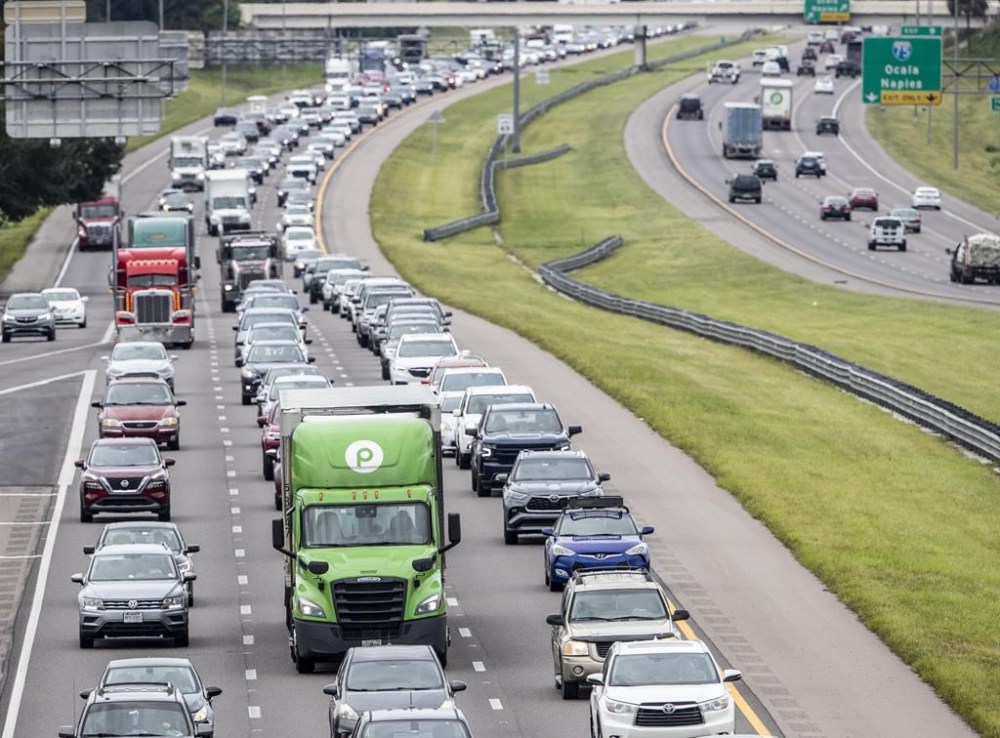 Traffic builds along Interstate 4 in Tampa, Fla., Tuesday, Sept. 27, 2022, as Hurricane Ian approaches. (Willie J. Allen Jr./Orlando Sentinel via AP)