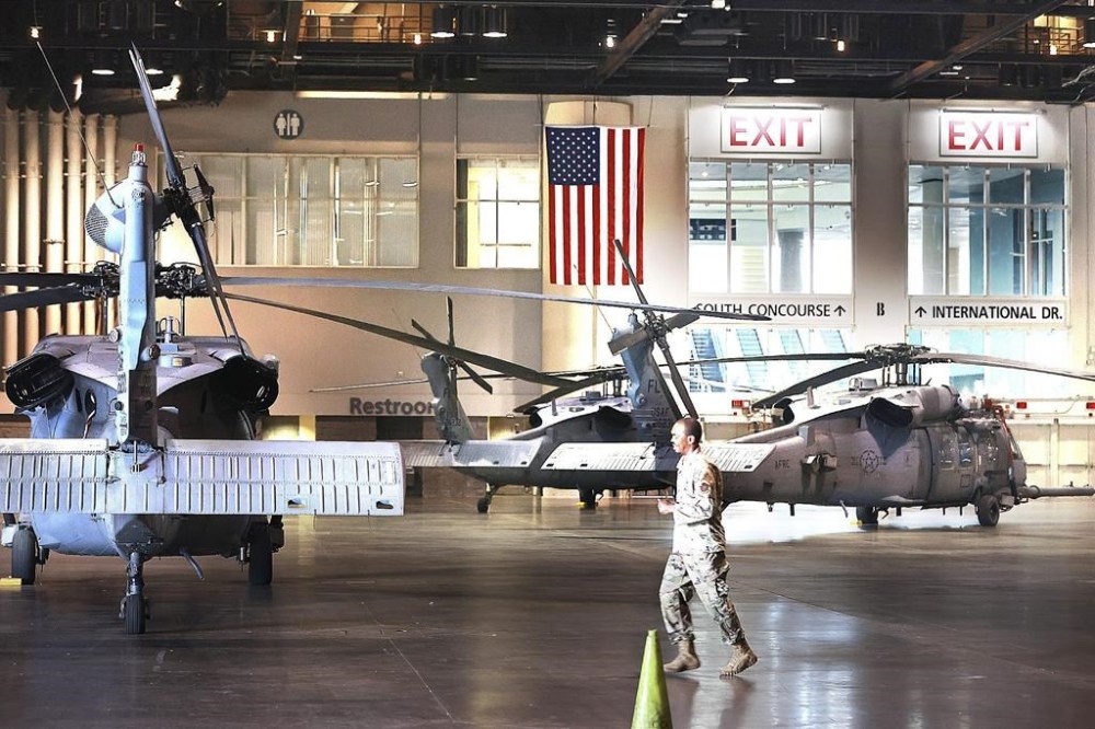 U.S. Air Force helicopters are gathered inside the Orange County Convention Center on Tuesday, Sept. 27, 2022. They were staging in preparation for Hurricane Ian, which is approaching Florida's west coast. (Stephen M. Dowell/Orlando Sentinel via AP)