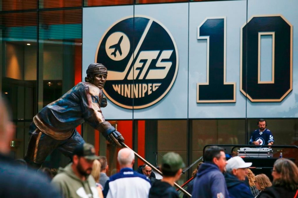 A statue in honour of former Winnipeg Jets player Dale Hawerchuk is unveiled at True North Square outside of the Canada Life Centre in Winnipeg, Saturday, October 1, 2022. THE CANADIAN PRESS/John Woods