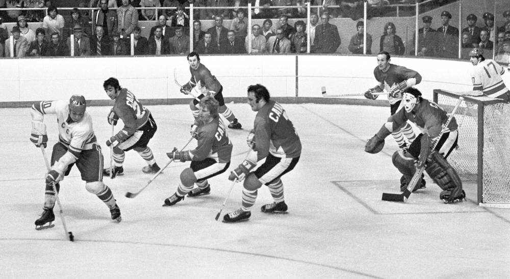 PETER BREGG / THE CANADIAN PRESS FILES
Team Canada players defend against USSR’s Alexander Maltsev in Winnipeg on Sept. 6. The game ended in a 4-4 tie.