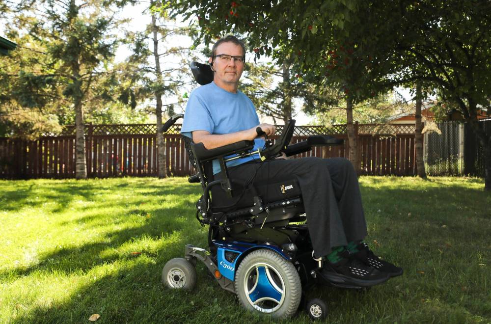 RUTH BONNEVILLE / WINNIPEG FREE PRESS
Local home care / quadriplegia Photo of Patrick Dram with quadriplegia in his wheelchair outside. He says home care isnմ always there for their four times a day visits. This weekend he was left for most of the day in bed because a staff member could not come into work. Story: Patrick Dram slipped and fell going inside his house a year ago and has been left with quadriplegia. He was released from the hospital recently after six months and then has had to live in his parentsՠhouse who are 93 and 83. Sept 6th, 2022