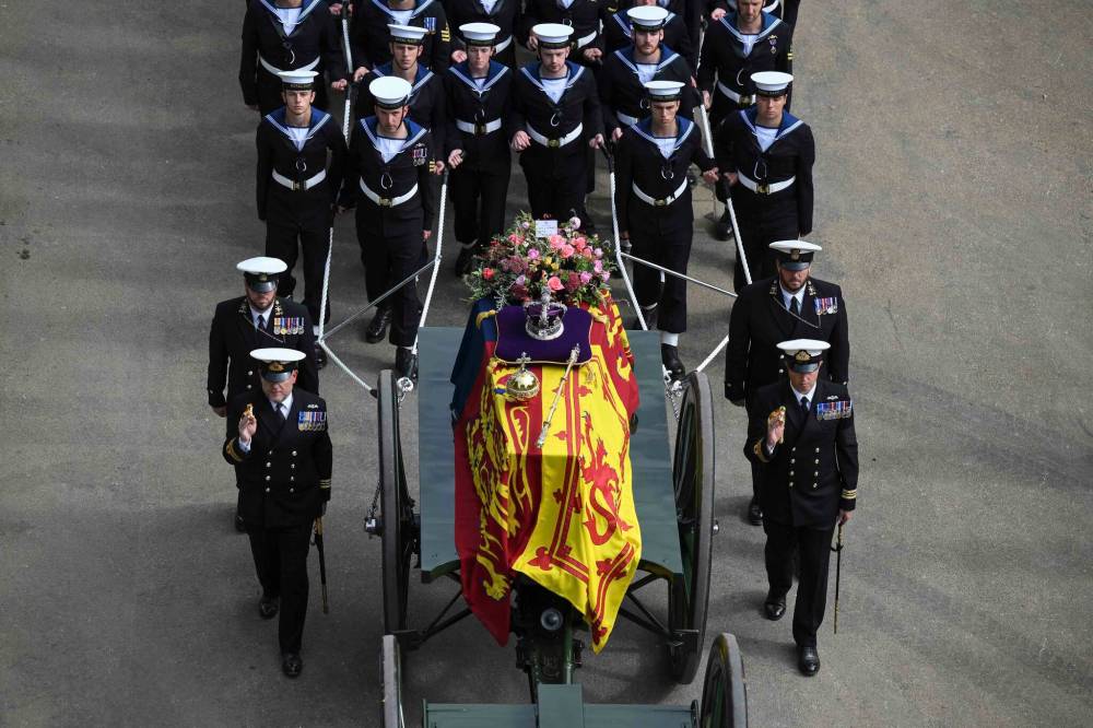 The Queen's coffin is carried past Wellington Arch following her funeral service in Westminster Abbey on Monday. (Daniel Leal / Pool photo via The Associated Press)