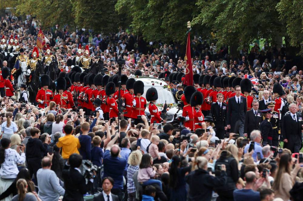 Thousands of people lined the streets in London and Windsor to witness the funeral procession. (Lee Smith / Pool photo via The Associated Press)