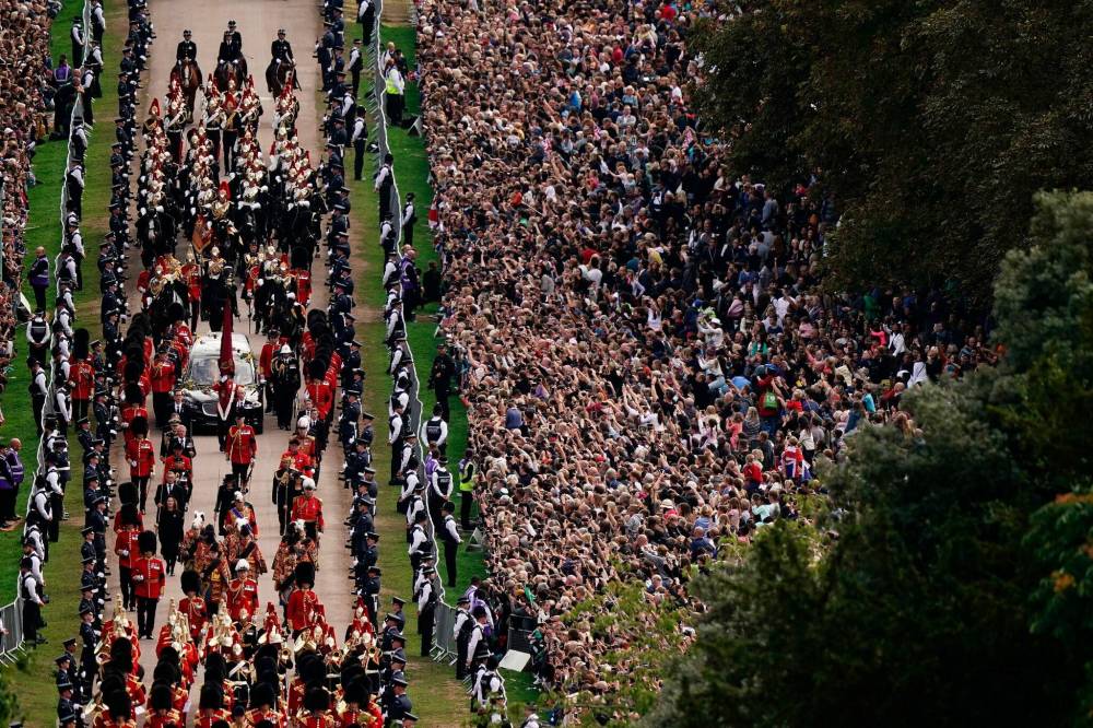 The Ceremonial Procession of the coffin of Queen Elizabeth II travels down the Long Walk as it arrives at Windsor Castle for the Committal Service at St George’s Chapel, in Windsor, England. (Aaron Chown / Pool photo via The Associated Press)